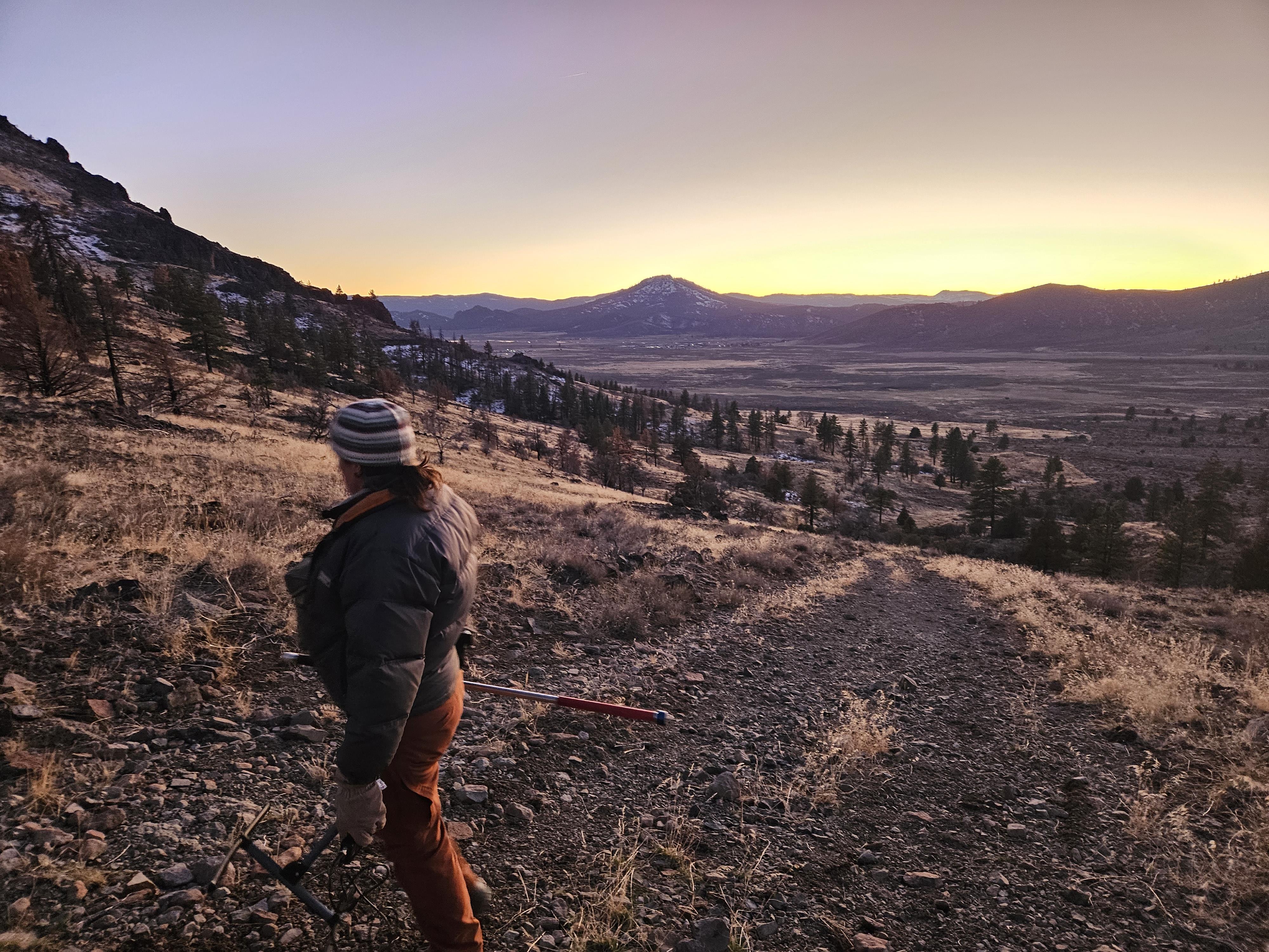 A CDFW biologist surveys for recently collared wolves in Plumas County